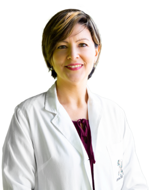 Woman with short brown hair wearing white nurse's coat over a red top