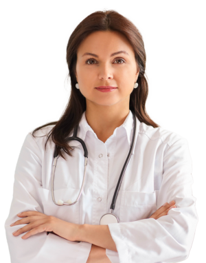 Young woman with long brown hair with two small white earrings wearing a white nurse's coat with a stethoscope hanging around her neck crossing her arms